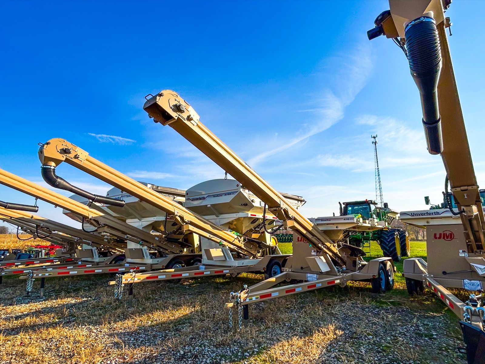 Unverferth seed tenders lined up on the lot at Koenig Equipment in Anna, Ohio