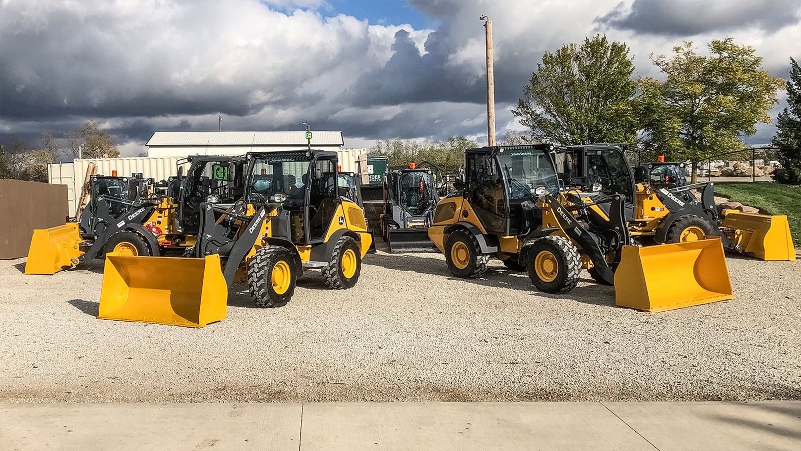 Row of John Deere compact wheel loaders in the Grunder Landscaping fleet