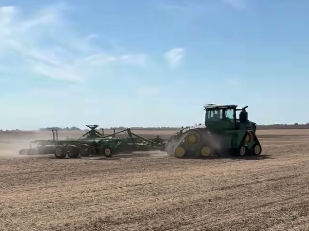 An autonomous John Deere 9RX track tractor pulling a 2660VT vertical tillage tool at Miers Farm Corp