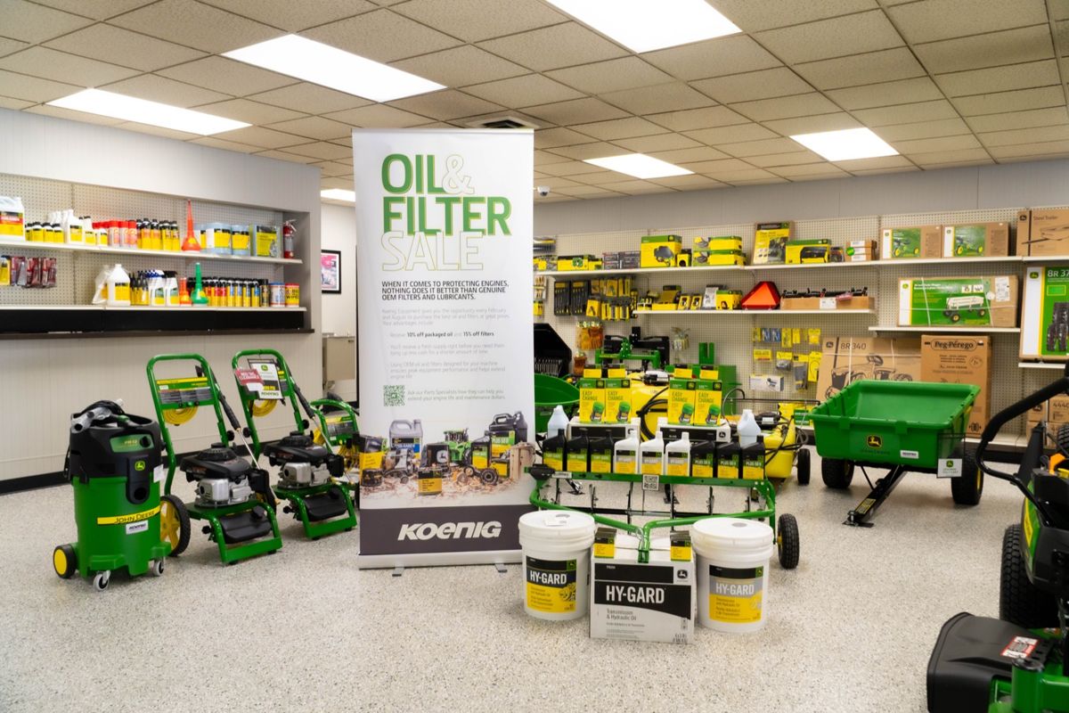 Oil and filter sale display with John Deere oils, filters and parts at a Koenig Equipment store