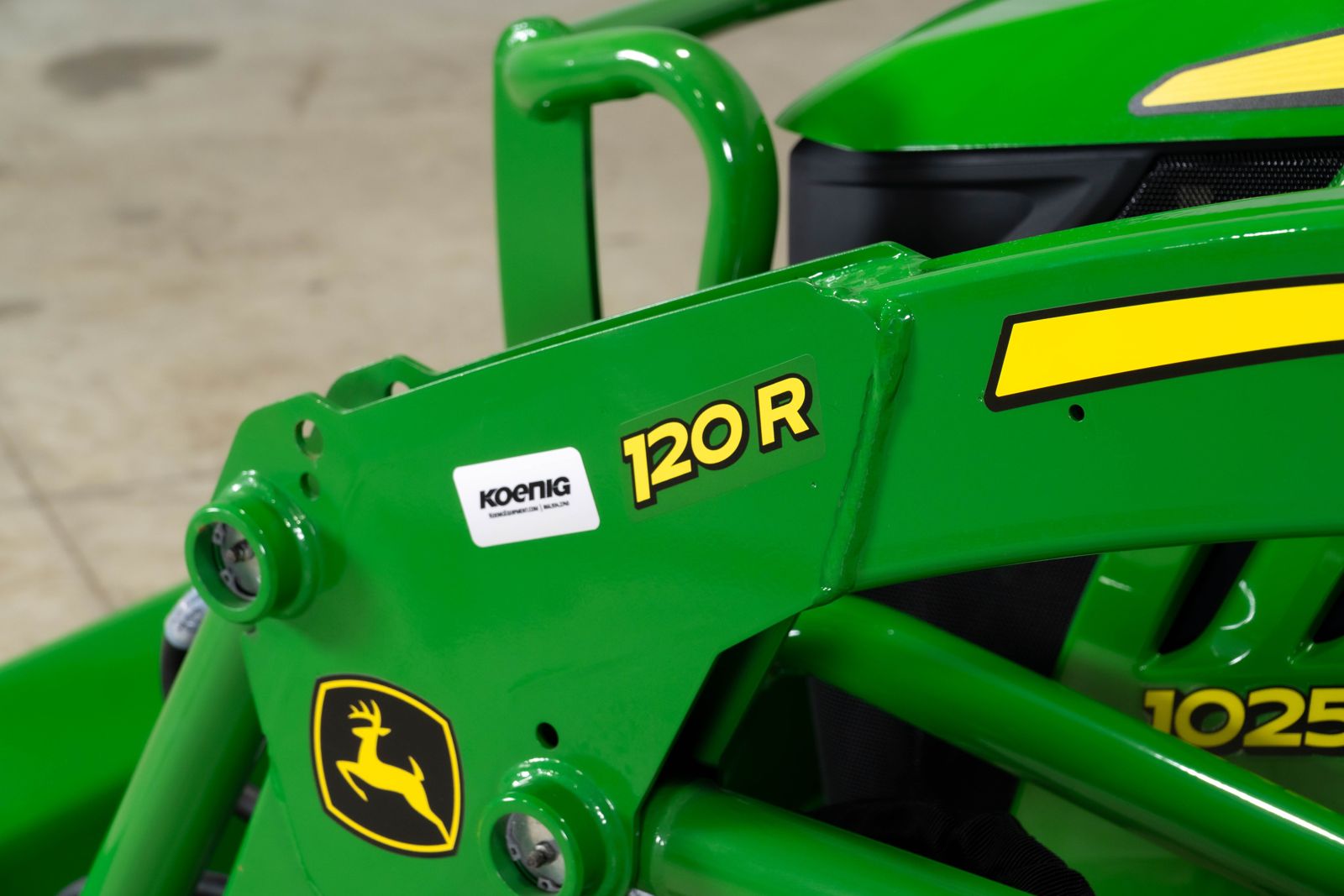 John Deere 120R loader arm on a 1025R compact tractor