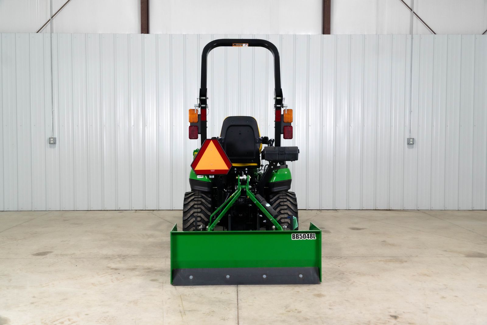 Rear view of the BB5048L box blade mounted on a John Deere 1025R