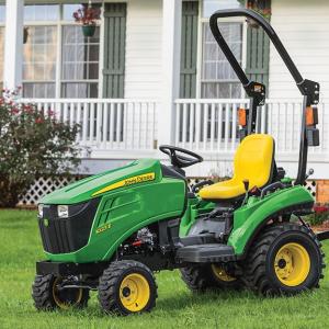 1023E Compact Tractor on lawn in front of house